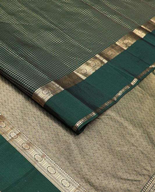 Green checked Vasundhara silk mix saree, zari border of manga, muthu, banaras, chakram, rudraksham, and diamond patterns, and paiyaadi kattam pallu
