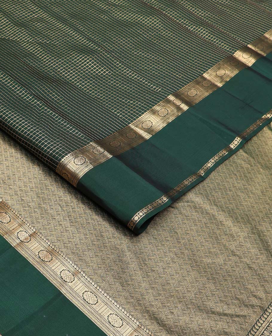 Green checked Vasundhara silk mix saree, zari border of manga, muthu, banaras, chakram, rudraksham, and diamond patterns, and paiyaadi kattam pallu