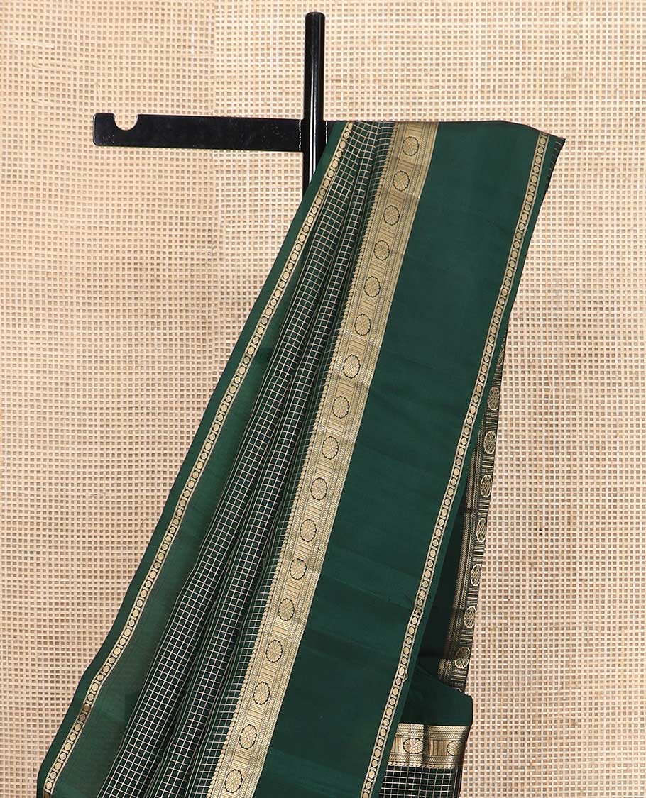 Green checked Vasundhara silk mix saree, zari border of manga, muthu, banaras, chakram, rudraksham, and diamond patterns, and paiyaadi kattam pallu
