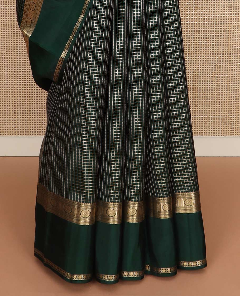 Green checked Vasundhara silk mix saree, zari border of manga, muthu, banaras, chakram, rudraksham, and diamond patterns, and paiyaadi kattam pallu