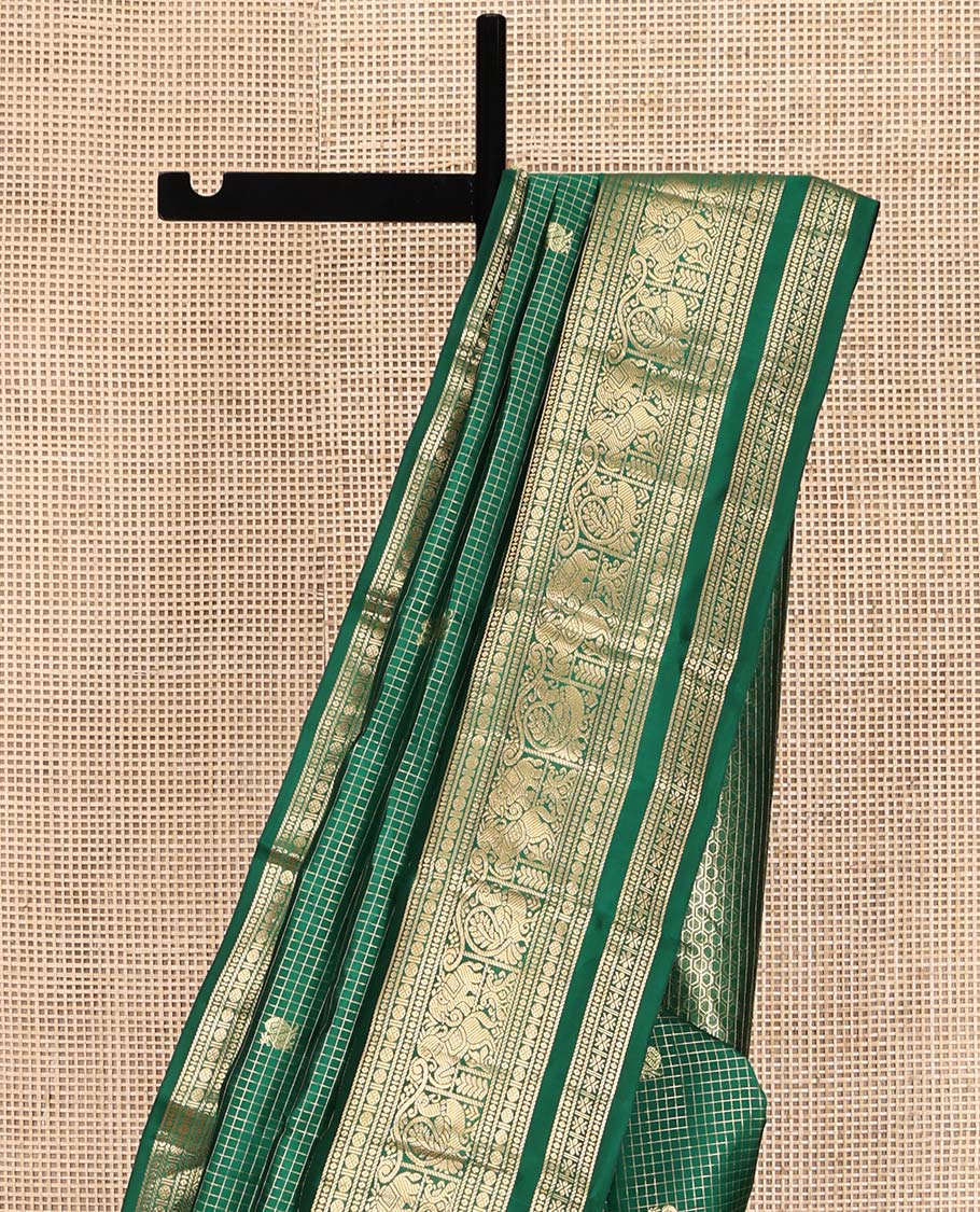 Green Vasundhara Lite Silk Mix Saree, Adorned with Mayil-Chakram Buttas and Zari Checks On Its Body, Highlighted by Zari Border of Rekku, Rudraksham, Mayil, and Kuthirai Designs, Grand Jaal Pallu and Paired with a Matching Blouse