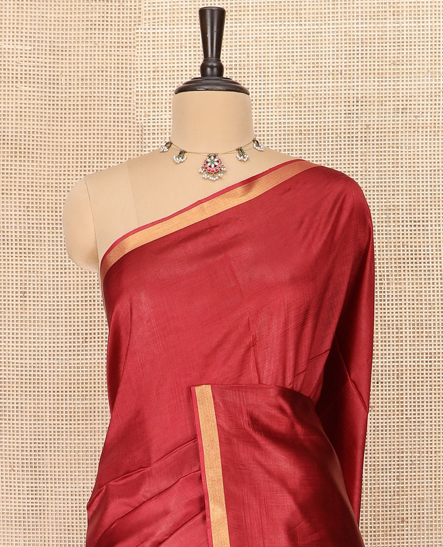 Maroon Plain Banana Pith Saree Subtly Sparkled with Zari Bavanji Border, Gleaming Zari Stripes Woven Pallu, and Paired with a Matching Plain Blouse