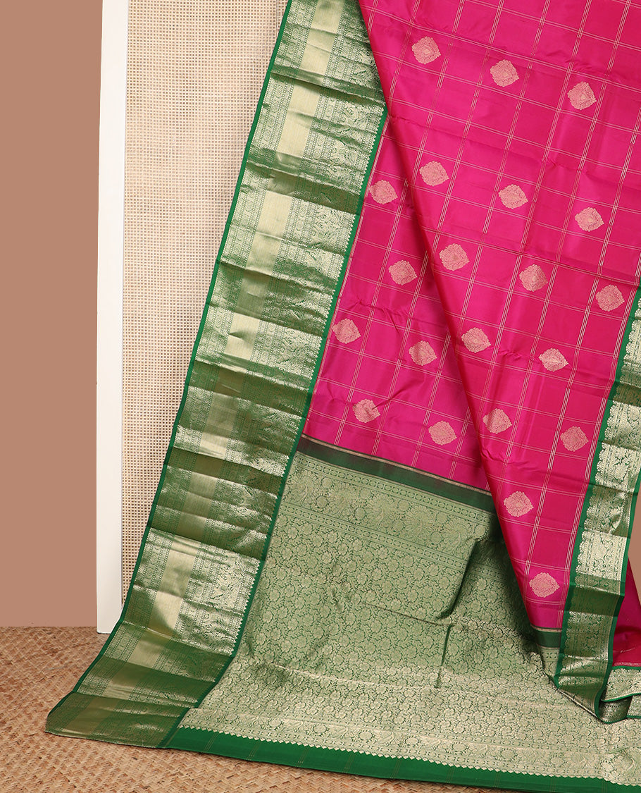 Dark pink zari buttas and checked silk saree, contrast border of rekku, muthu, diamond, yaanai, and chakram designs, and floral jaal pallu