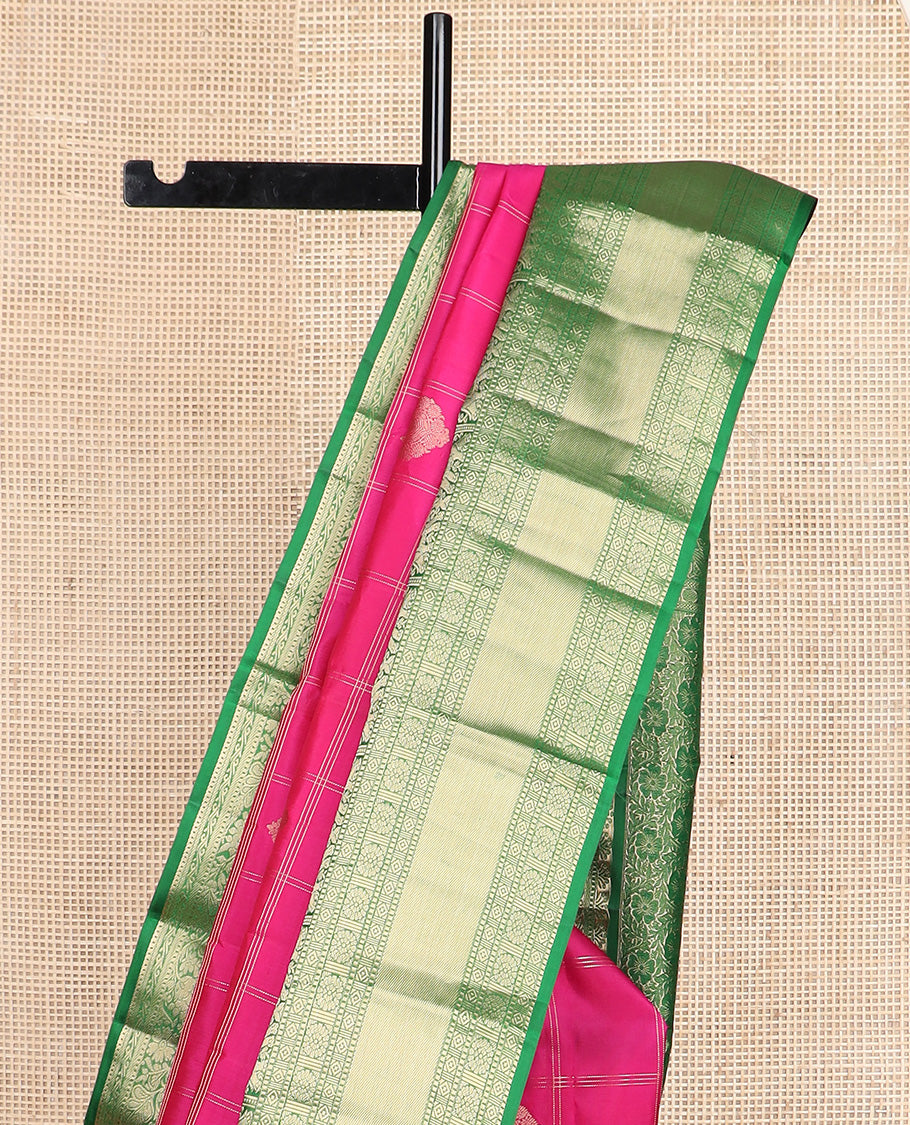 Dark pink zari buttas and checked silk saree, contrast border of rekku, muthu, diamond, yaanai, and chakram designs, and floral jaal pallu