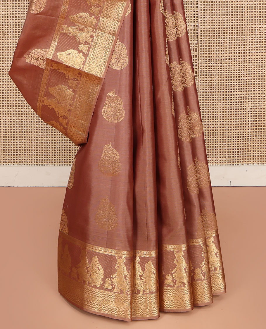 Pinkish Brown Vasundhara Silk Saree, Elevated with Zari Buttas All Over Its Body, Highlighted by Zari Border of Rekku, Muthu, Vangi, and Bride-Groom Suyamvaram Designs, Pallu of Zari Designs, and Paired with a Matching Blouse
