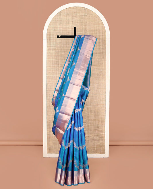 Blue Vasundhara Silk Saree, Delicately Woven with Jaal Jacquard Design All Over Its Body, Highlighted by a Zari Border of Thilakam Mokku, Jaal, and Lavangam Designs, Grand Jaal Pallu, and Paired with a Matching Blouse