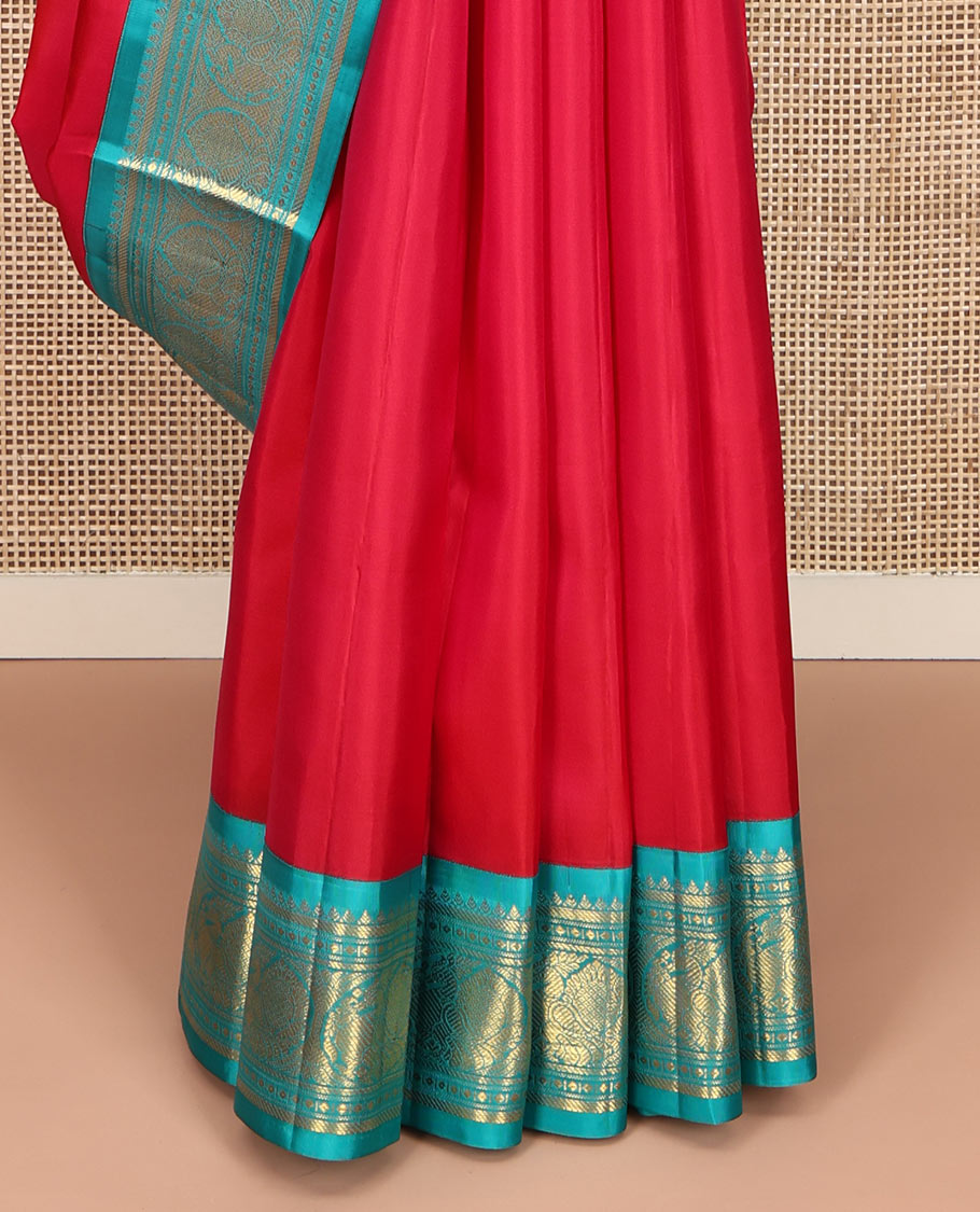 Red Vasundhara Silk Saree, Sparsely Woven with Zari Buttas All Over Its Body, Complemented by a Contrast Border of Rekku, Banaras, Diamond, and Round Mayil Designs, Grand Jaal-Patterned Pallu, and Paired with a Contrast Blouse