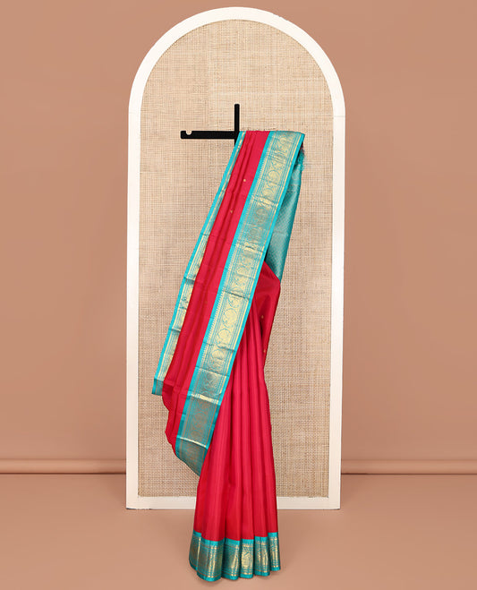 Red Vasundhara Silk Saree, Sparsely Woven with Zari Buttas All Over Its Body, Complemented by a Contrast Border of Rekku, Banaras, Diamond, and Round Mayil Designs, Grand Jaal-Patterned Pallu, and Paired with a Contrast Blouse