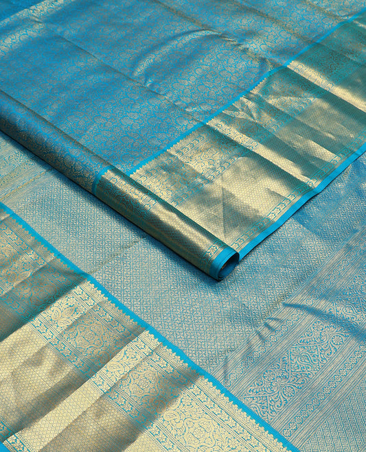 Blue floral jacquard Kanchipuram wedding silk saree, zari border of floral, manga, and mayil kann designs, and jaal pallu
