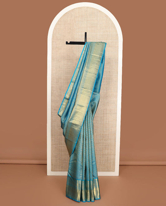 Blue floral jacquard Kanchipuram wedding silk saree, zari border of floral, manga, and mayil kann designs, and jaal pallu