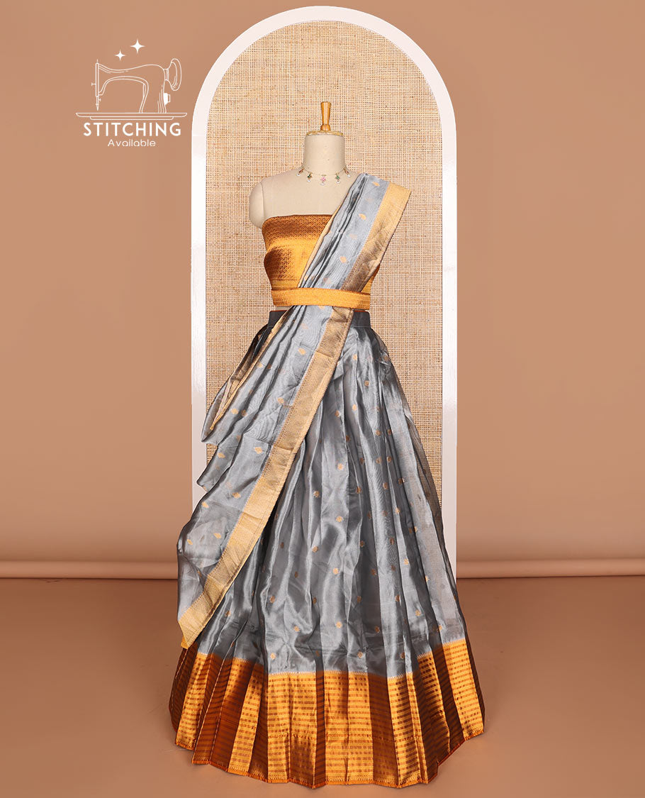 Grey  floral butta tissue half saree with contrast zari design border, floral zari design blouse & floral design dhavani