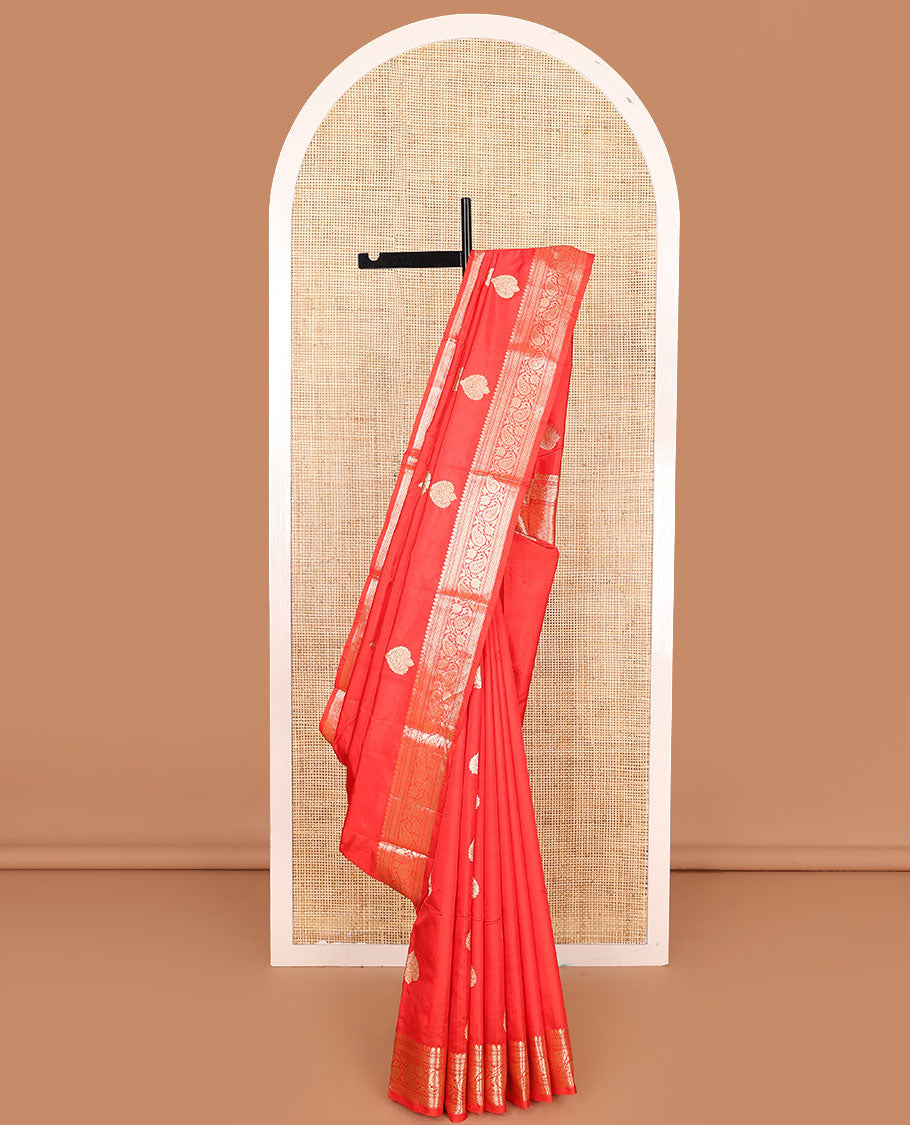 Red zari buttas kathan silk saree, traditional border of paisley creeper designs, and jaal pallu