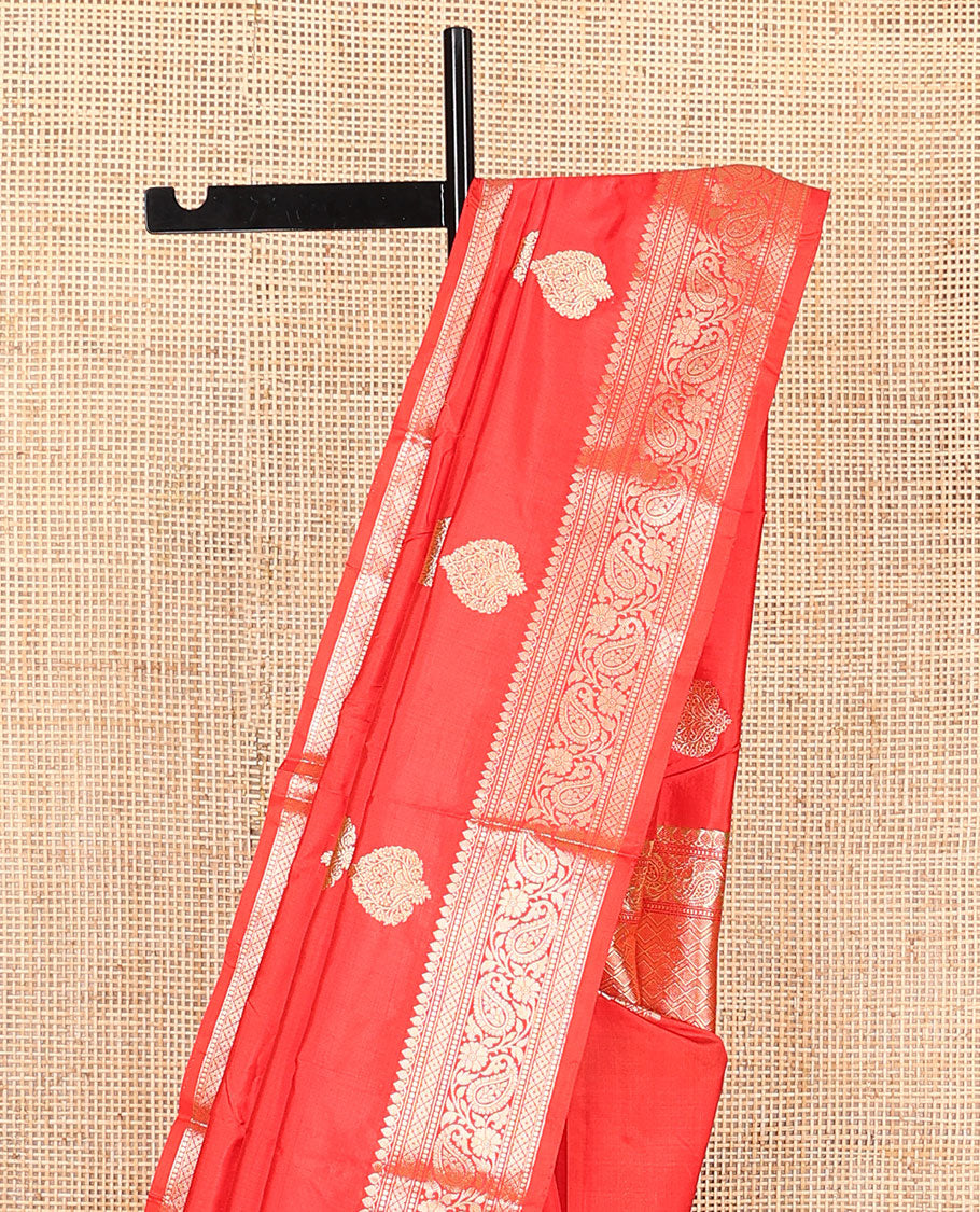 Red zari buttas kathan silk saree, traditional border of paisley creeper designs, and jaal pallu