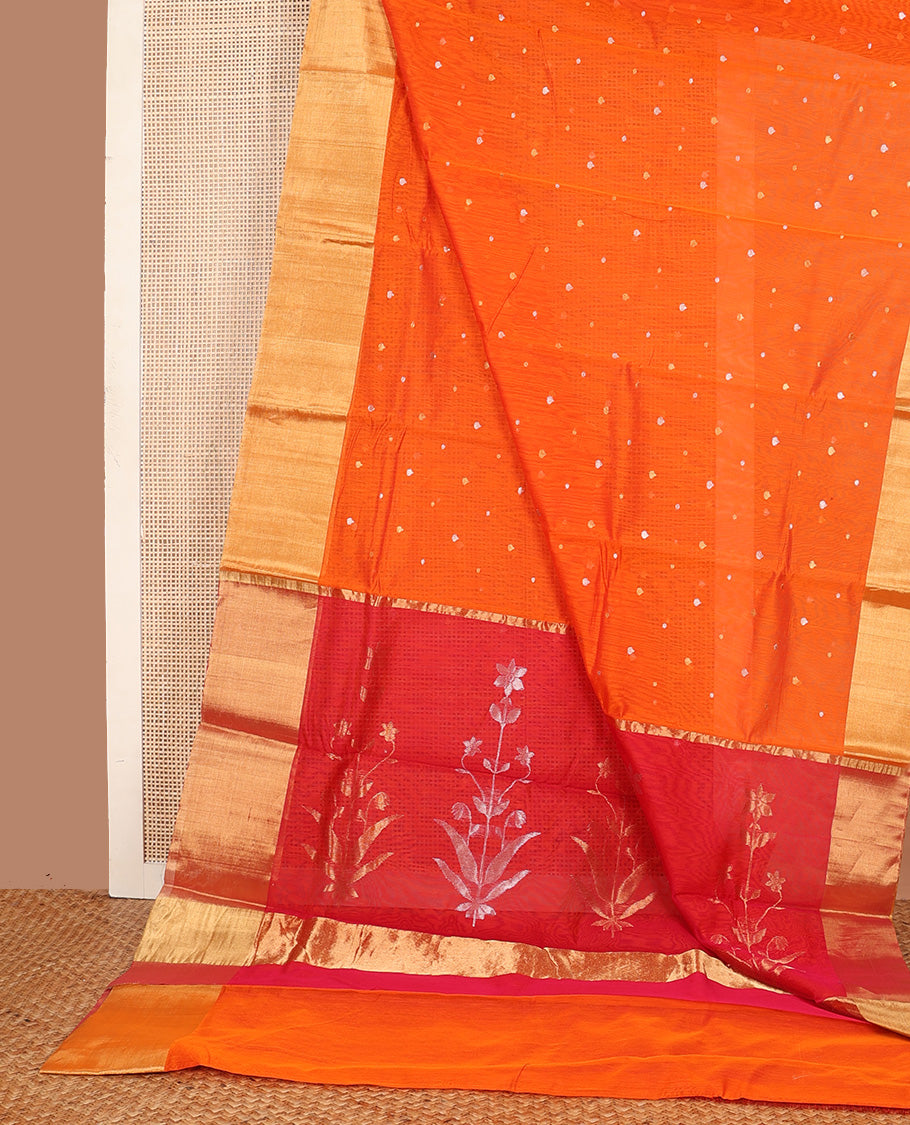 Orange buttas silk saree, bavanji border, and contrast floral zari woven pallu
