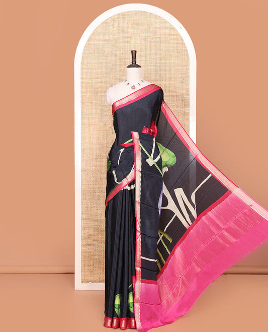 Black Georgette Saree Highlighted with Unique Print, Complemented by a Contrast Traditional Zari Border, Pallu Gleamed Up with Zari, and Paired with a Contrast Buttas Woven Blouse