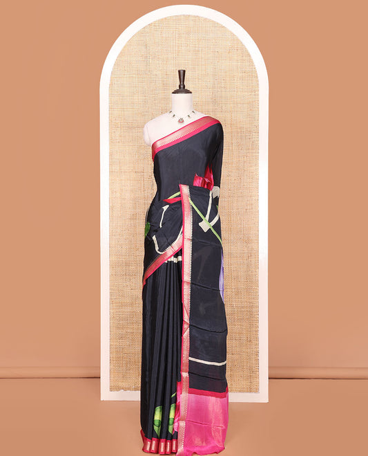 Black Georgette Saree Highlighted with Unique Print, Complemented by a Contrast Traditional Zari Border, Pallu Gleamed Up with Zari, and Paired with a Contrast Buttas Woven Blouse