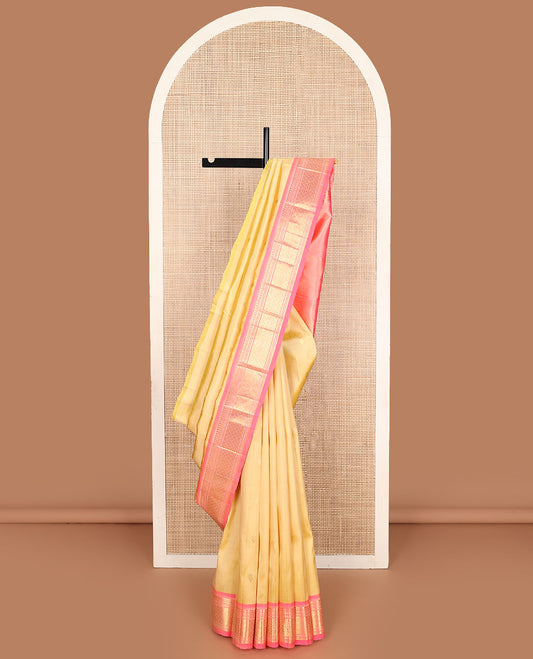 Yellow zari buttas Kanchipuram silk saree, contrast one-sided border of paneer sombu, banaras, muthu, and jaal designs, and zari design pallu