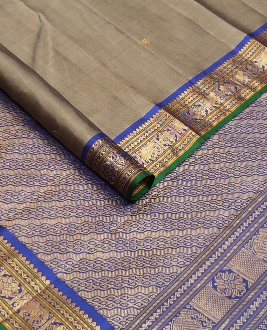 Grey mayil chakram buttas silk saree, contrast border of thilakam mokku,banaras,neli,yaanai & manga & pallu of intricate designs