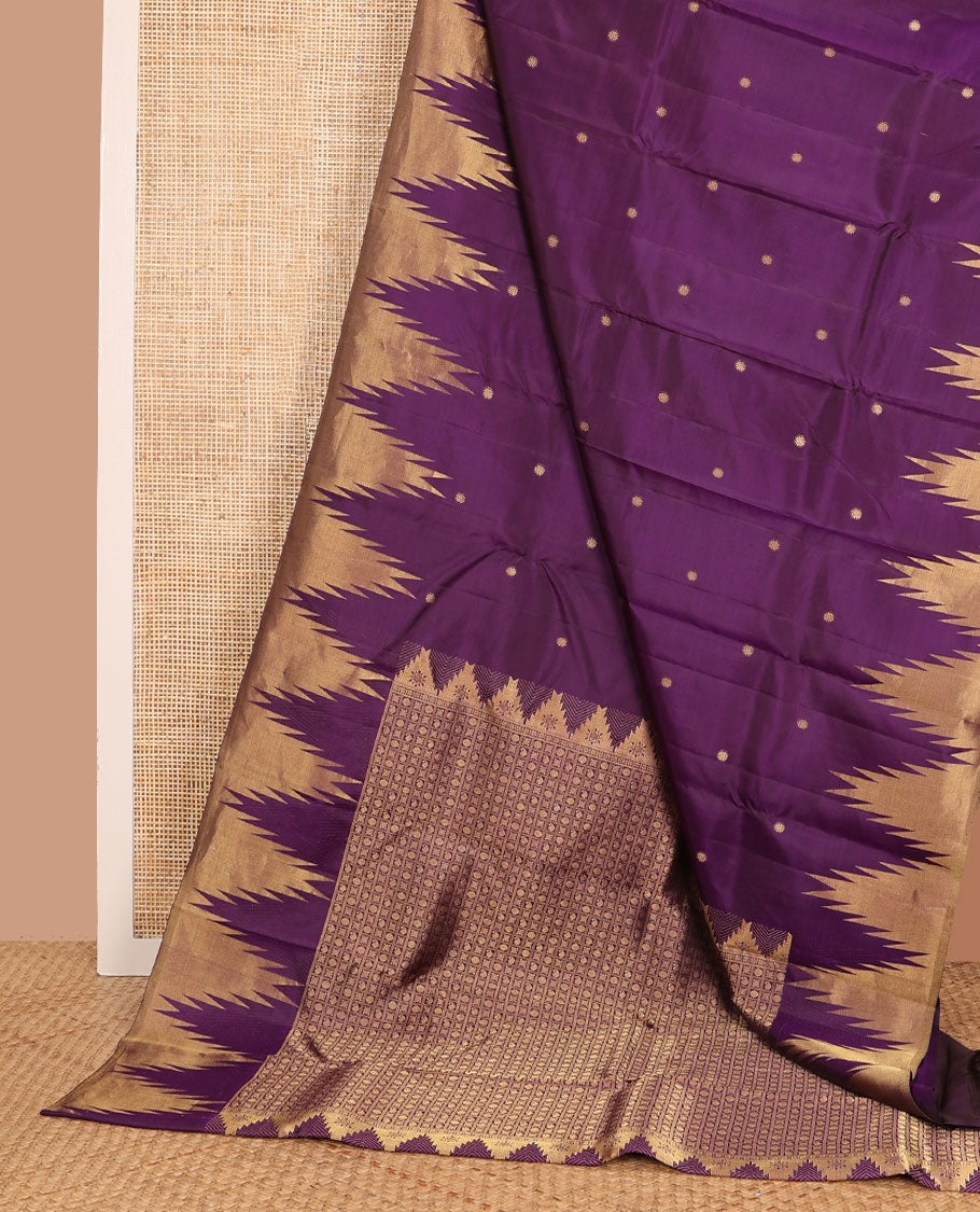Purple zari buttas Kanchipuram silk saree, thazampoo rekku zari border, and pallu of manga, kolam, and rudraksham motifs enclosed checks