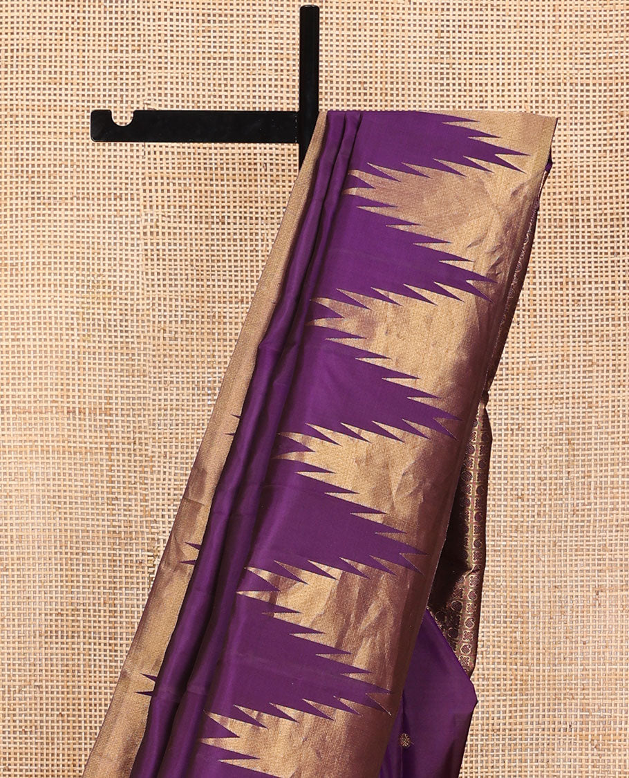 Purple zari buttas Kanchipuram silk saree, thazampoo rekku zari border, and pallu of manga, kolam, and rudraksham motifs enclosed checks