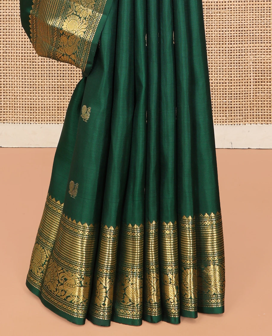 Green Kanchipuram Silk Saree, Elevated with Mayil-Chakram Buttas, a Zari Border of Rekku, Muthu, Mayil Kann, Banaras, Mayil, and Yaali Designs, Jaal Pallu, and a Matching Blouse