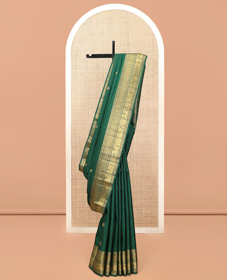 Green Kanchipuram Silk Saree, Elevated with Mayil-Chakram Buttas, a Zari Border of Rekku, Muthu, Mayil Kann, Banaras, Mayil, and Yaali Designs, Jaal Pallu, and a Matching Blouse