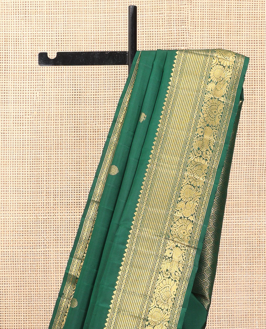 Green Kanchipuram Silk Saree, Elevated with Mayil-Chakram Buttas, a Zari Border of Rekku, Muthu, Mayil Kann, Banaras, Mayil, and Yaali Designs, Jaal Pallu, and a Matching Blouse
