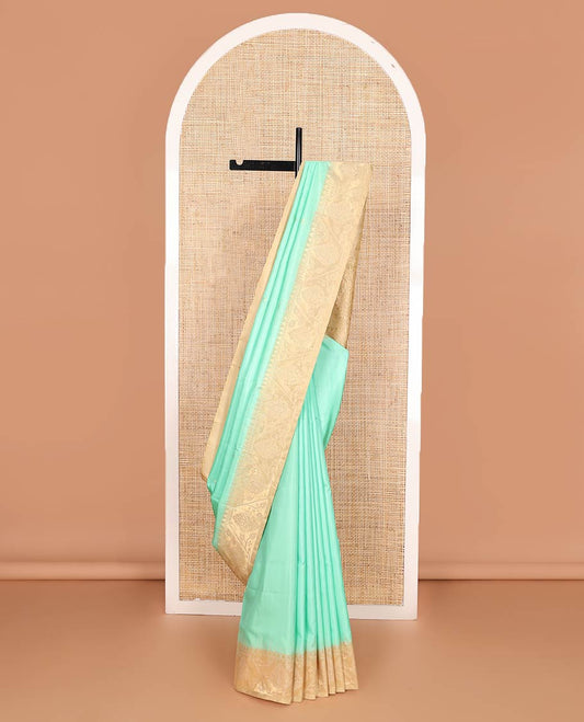 Turquoise blue zari buttas soft silk saree, contrast border, and pallu of paithani-style motifs weave