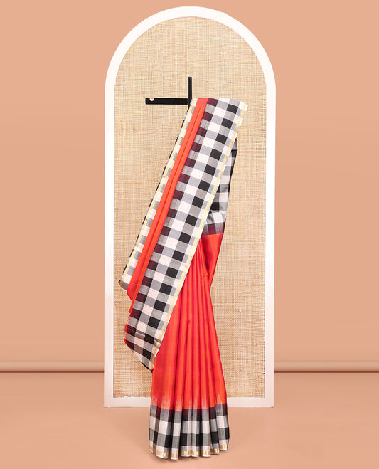 Orange Plain Mayuri Soft Silk Saree, Complemented by a Contrast Black-White Chess-Style Checked Border, Chess-Style Checked Pallu, and Paired with a Contrast Blouse