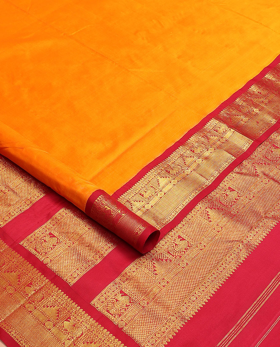 Orange plain nine-yard silk saree, contrast korvai  border of thilakam mokku, Muthu, manga, mayil, rekku, and kuyil kann designs, and zari design pallu