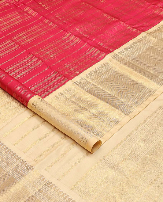 Red muthu striped silks saree, contrast border of manga mokku, muthu, poun, and mayli kann designs, and zari design pallu