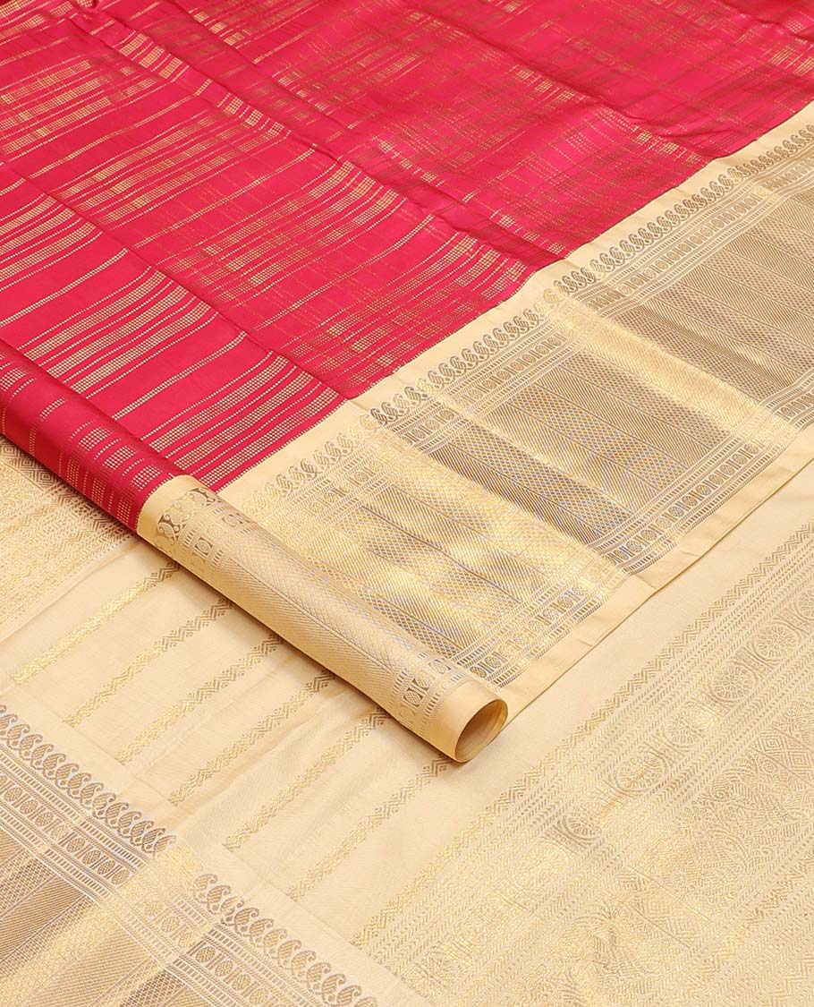 Red muthu striped silks saree, contrast border of manga mokku, muthu, poun, and mayli kann designs, and zari design pallu