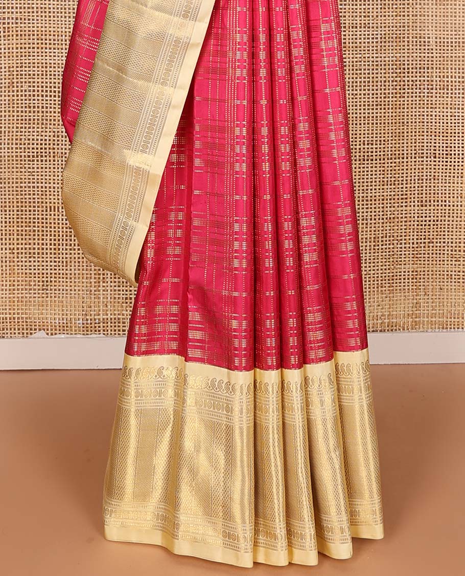 Red muthu striped silks saree, contrast border of manga mokku, muthu, poun, and mayli kann designs, and zari design pallu