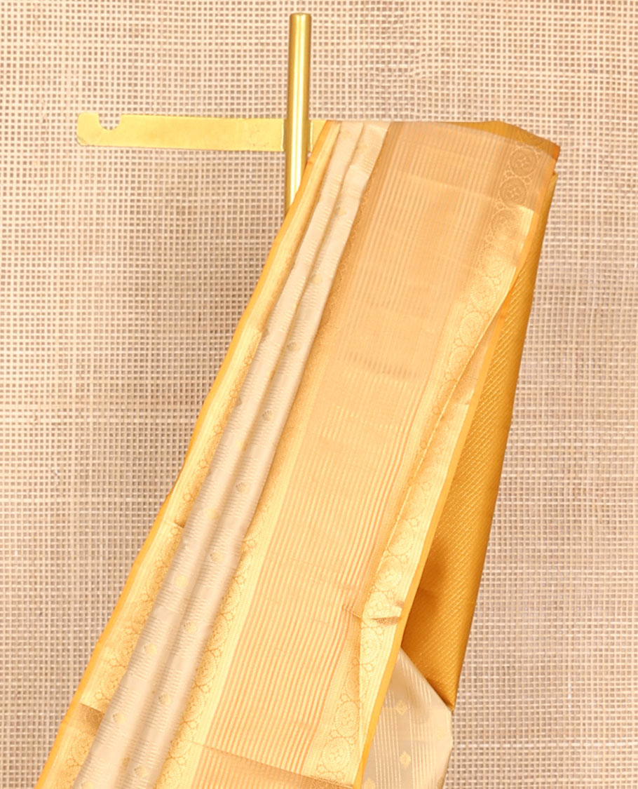 Cream zari buttas woven Vasundhara silk mix saree, contrast border of banaras, muthu & chakram designs & zari-rich pallu