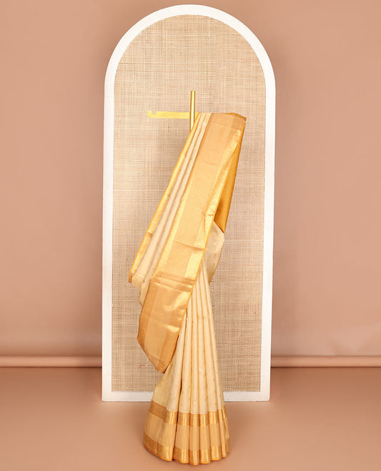 Cream zari buttas woven Vasundhara silk mix saree, contrast border of banaras, muthu & chakram designs & zari-rich pallu