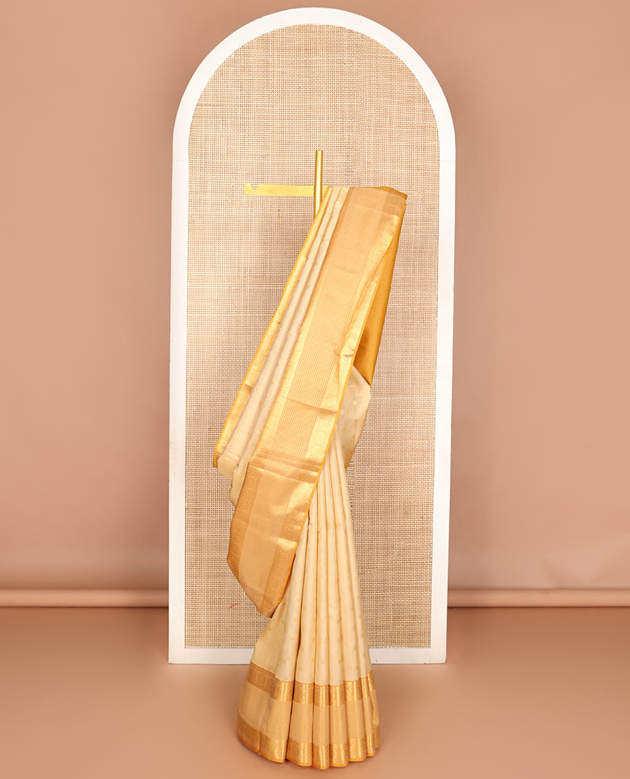 Cream zari buttas woven Vasundhara silk mix saree, contrast border of banaras, muthu & chakram designs & zari-rich pallu