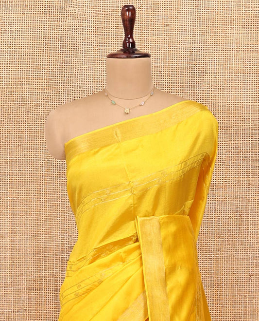 Yellow Banana Pith Saree, Sparsely Woven with Buttas and Stripes on Its Body, Subtly Zari Border, Pallu Steeped with Zari Stripes, and Paired with a Matching Blouse