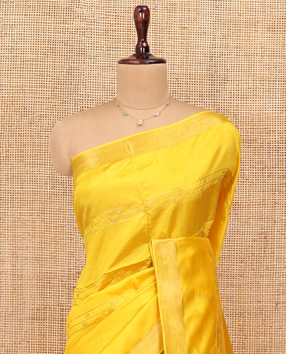 Yellow Banana Pith Saree, Sparsely Woven with Buttas and Stripes on Its Body, Subtly Zari Border, Pallu Steeped with Zari Stripes, and Paired with a Matching Blouse
