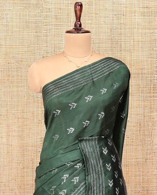 Green Banana Pith Saree, Subtly Sparkled with Buttas All Over Its Body, Highlighted by Self-Border, Pallu of Stripes, and Paired with a Matching Blouse