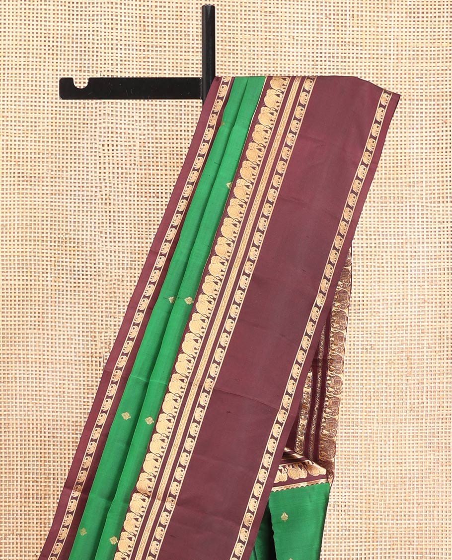 Green Vasundhara Silk Saree, Elevated with Zari Buttas All Over Its Body, Complemented by a Contrast Rettai Pettu Border of Yaanai Designs, Grand Jaal Pallu, and Paired with a Contrast Blouse