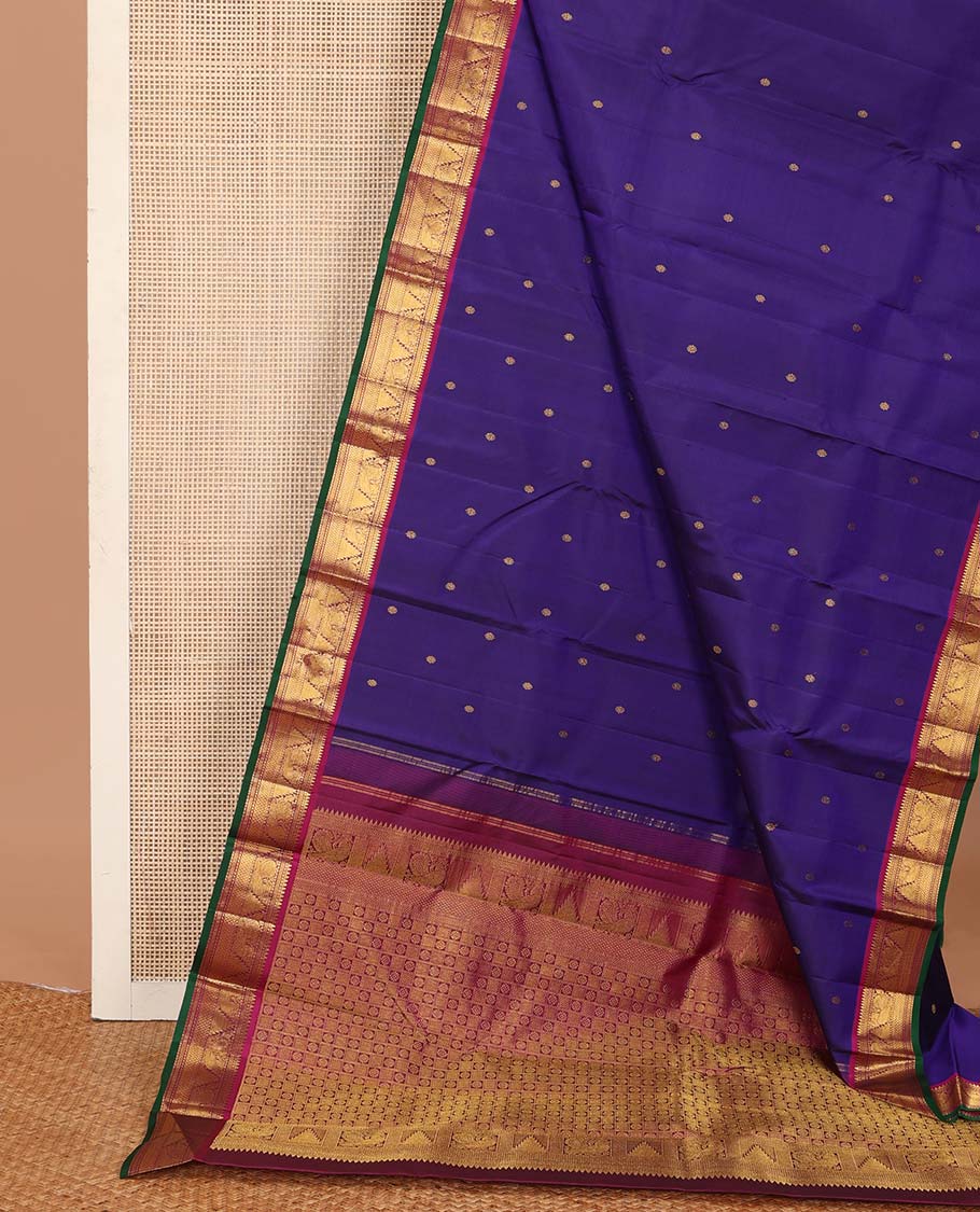 Blue buttas Kanchipuram silksaree, contrast border of rekku,muthu,mayil kann,thazampoo rekku, and mayil, and pallu of laddu kamalam, and mayil kann enclosed checks