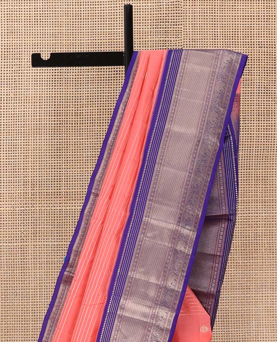 Orange zari design silk saree, contrast border of rekku, Muthu, kathir, rudraksham, and yaanai motifs, and geometric patterned pallu
