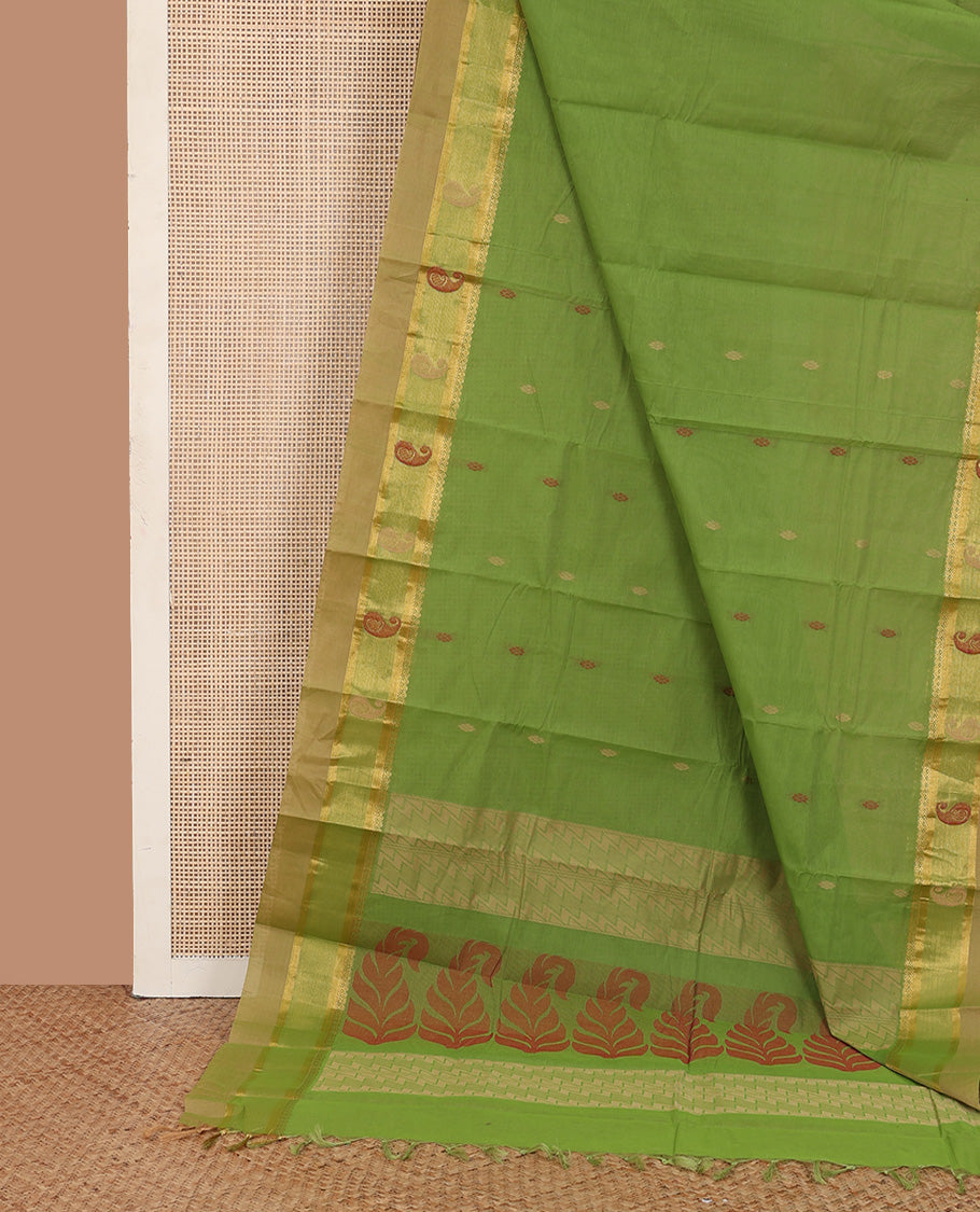 Parrot green buttas kanchi cotton saree, contrast thread and zari paisley border, and pallu of chevron and leaf motifs