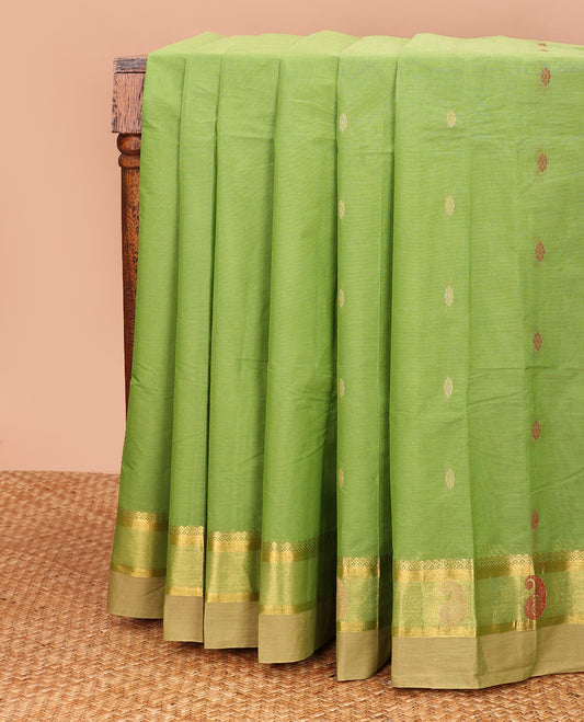 Parrot green buttas kanchi cotton saree, contrast thread and zari paisley border, and pallu of chevron and leaf motifs