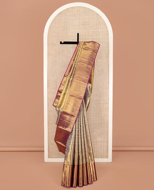 Gleaming Wine Kanchipuram Silk Saree, Gracefully Embellished with Jacquard Design All Over Its Body, Highlighted by a Zari Border of Thilakam, Muthu, Kathir, Mayil Kann, and Mayil Designs, and Pallu of Jaal Designs, and Paired with a Matching Blouse
