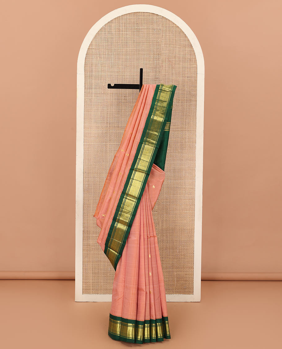 Peach zari buttas Kanchipuram silk saree, contrast one-sided korvai zari border of thilakam mokku, banaras, and jaal, and zari design pallu