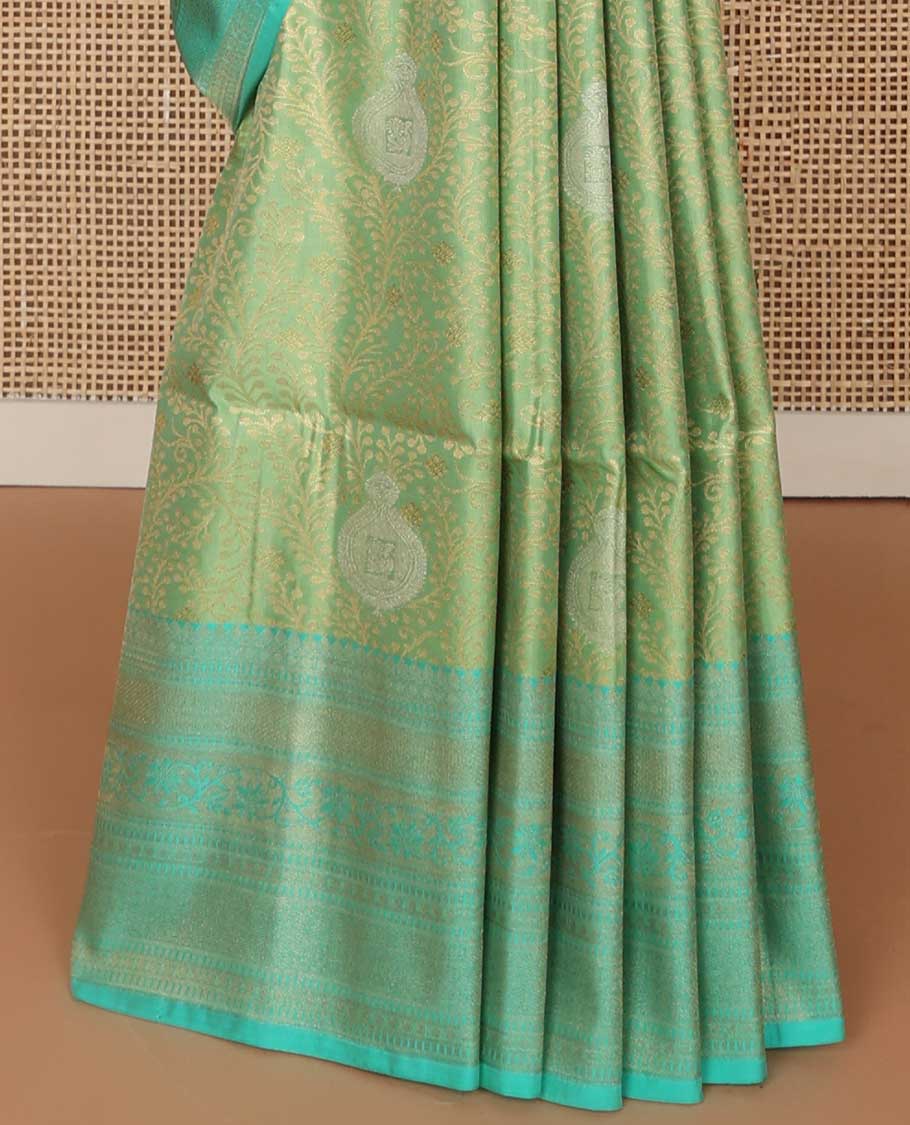 Green floral jacquard soft silk saree with contrast intricate zari design border & floral design pallu