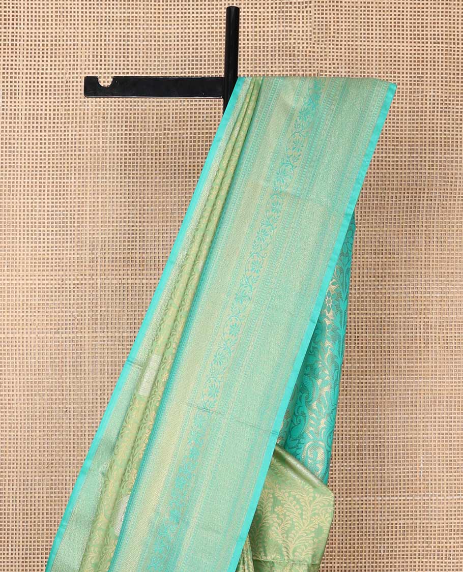 Green floral jacquard soft silk saree with contrast intricate zari design border & floral design pallu