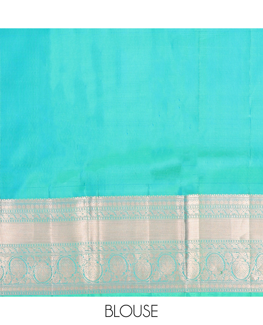 Green Kanchipuram Wedding Silk Saree Decorated with Jacquard Designs, Highlighted with a Zari Border of Rekku, Muthu, Rudraksham, Mayil Kann, and Dhavani Kodi Designs, Artfully Detailed Pallu, and Paired with a Matching Blouse