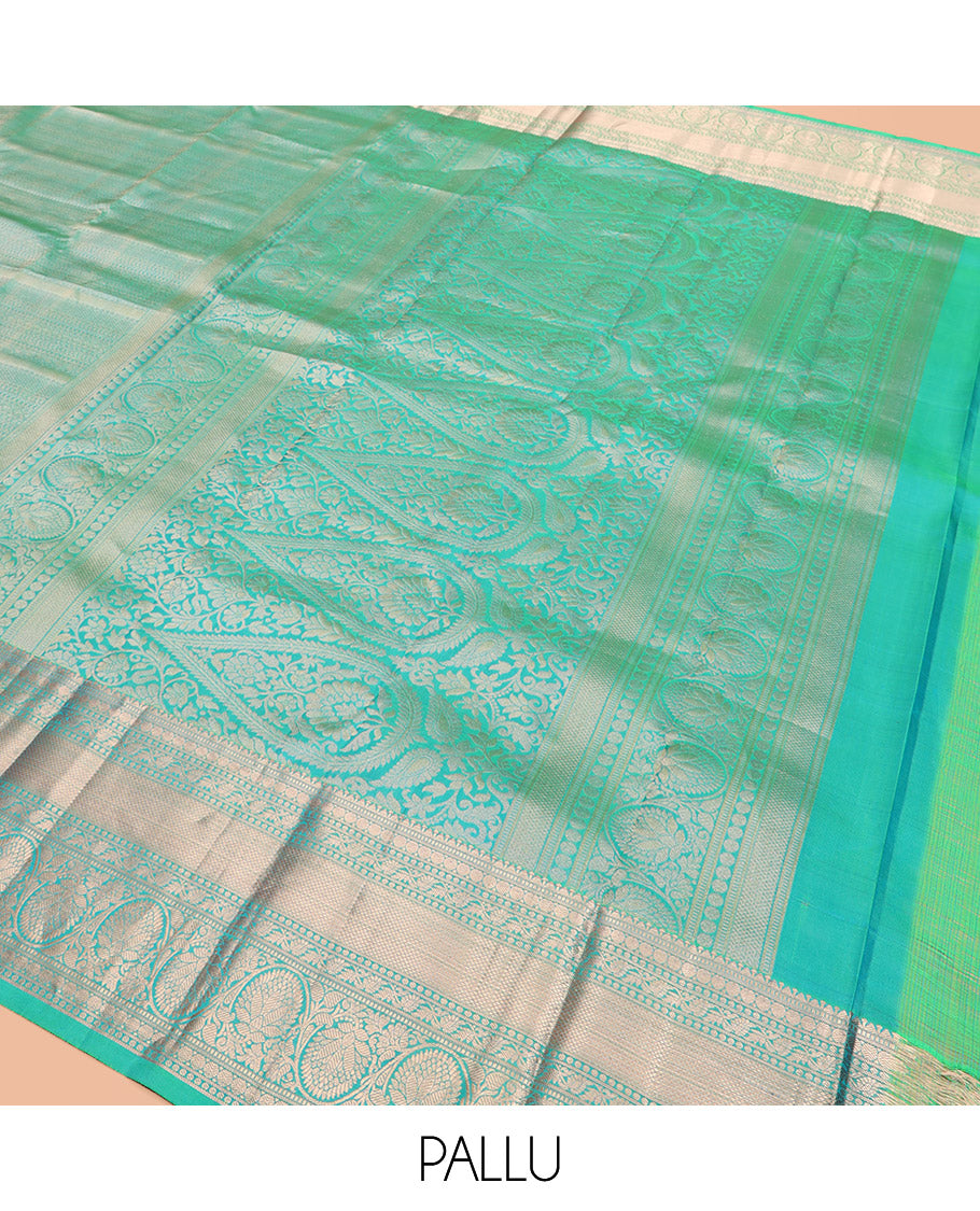 Green Kanchipuram Wedding Silk Saree Decorated with Jacquard Designs, Highlighted with a Zari Border of Rekku, Muthu, Rudraksham, Mayil Kann, and Dhavani Kodi Designs, Artfully Detailed Pallu, and Paired with a Matching Blouse
